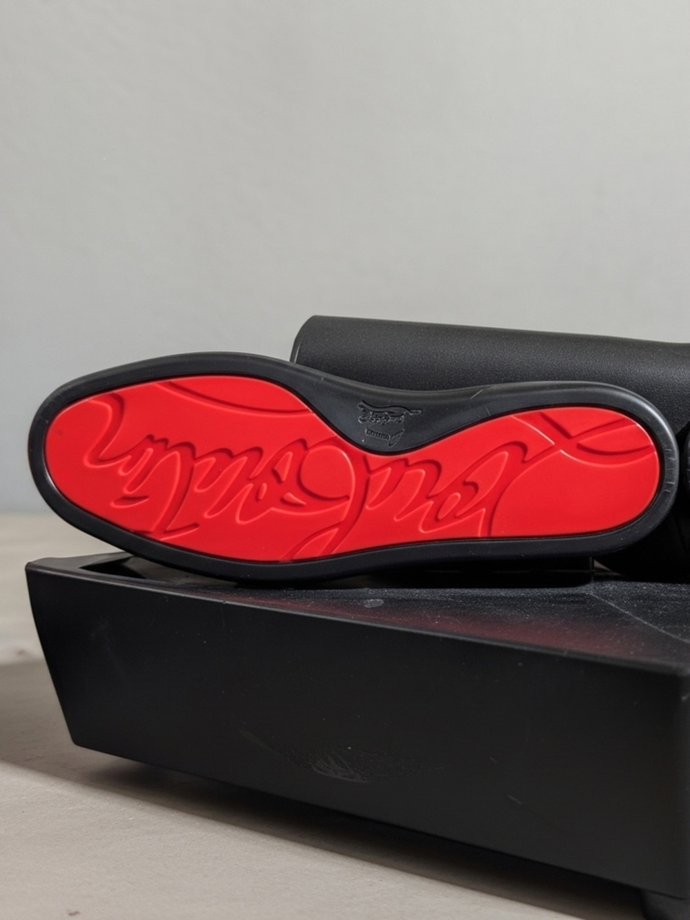 Christian Louboutin Red-Soled Black Shoe (Visible Red Sole)